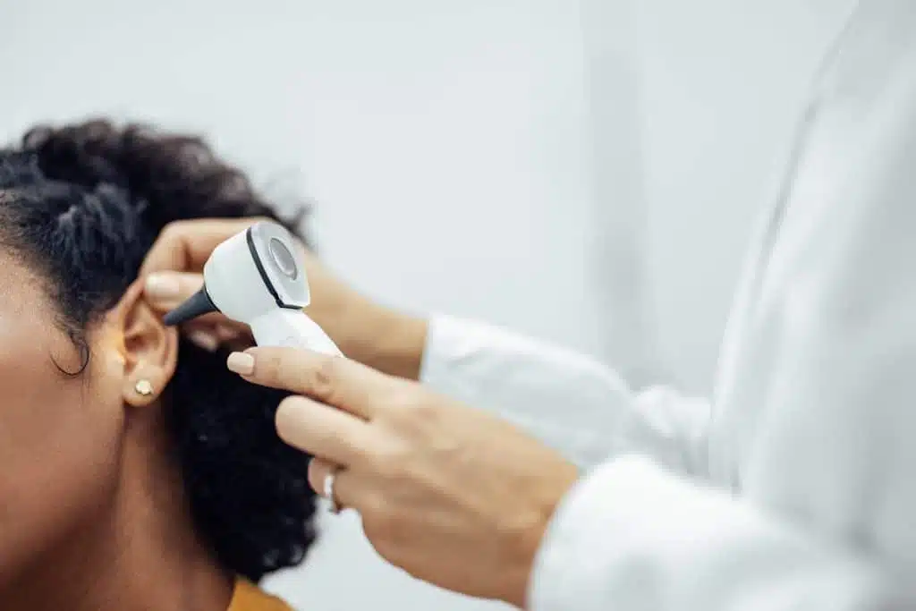 ear examination, close up.