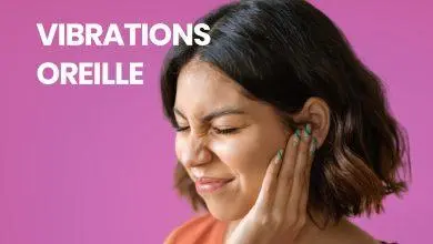 Femme ressentant des vibrations dans l'oreille