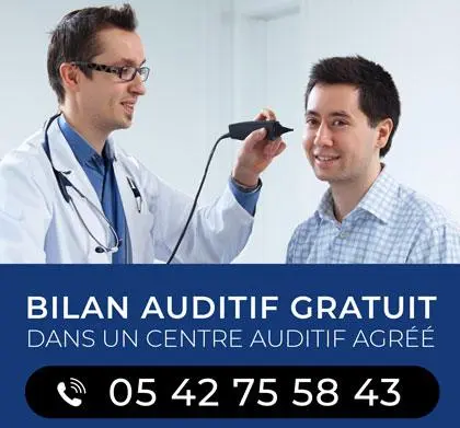 Bilan auditif gratuit, médecin et patient souriant.